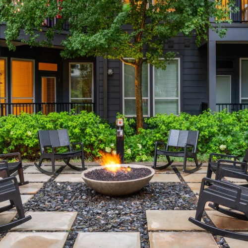 The essence of exceptional living a fire pit in front of a building