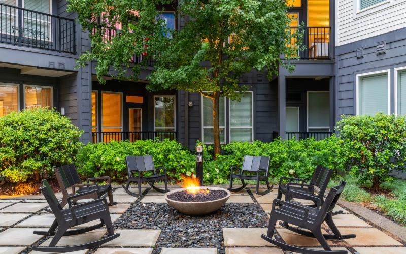 a fire pit in front of a building