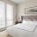 a bedroom with a bed and a lamp