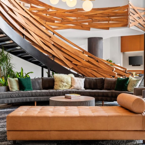 Find your perfect fit at Emerson at Montford Park a room with a spiral staircase and a couch underneath it