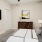 a bedroom with a bed and a tv