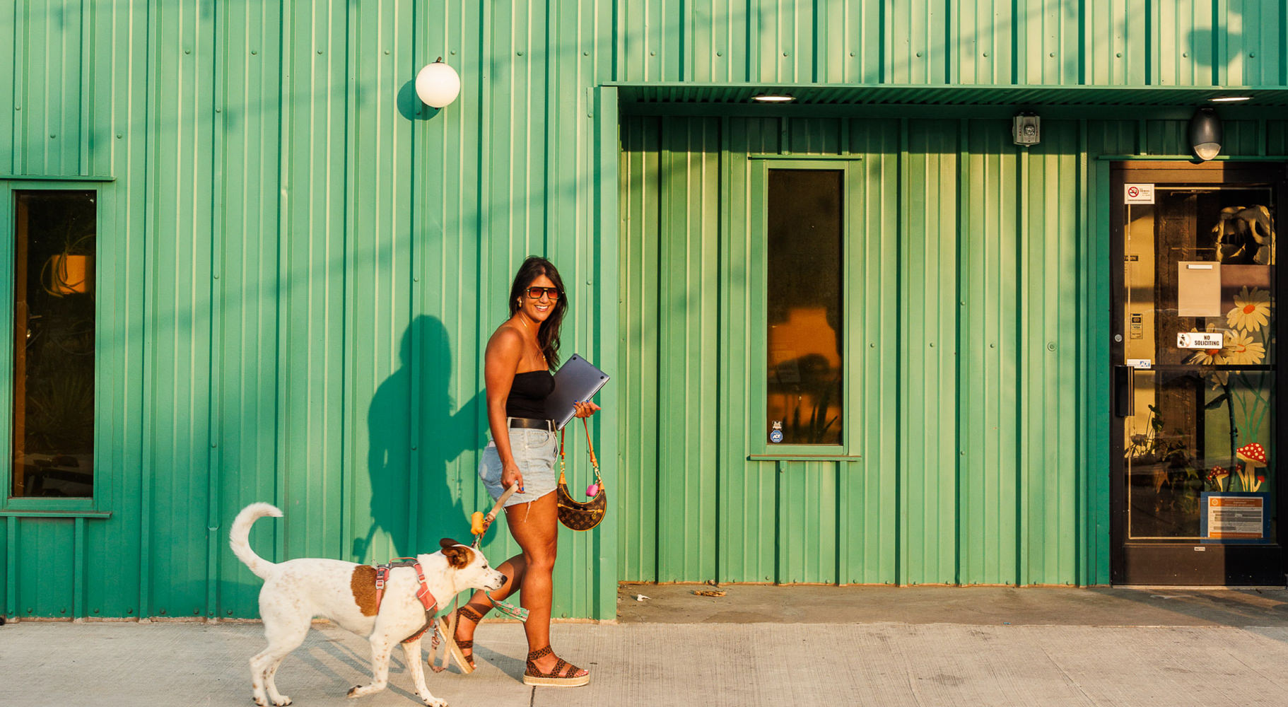 a woman walking her dog